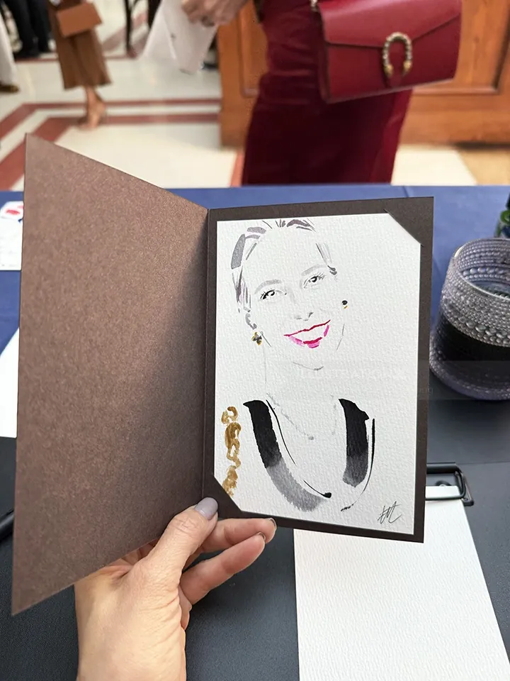 Hand holding a live event portrait illustration by Elise Lee