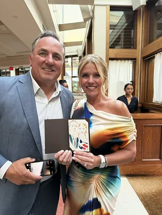 Man and woman holding a live event illustration by Elise Lee