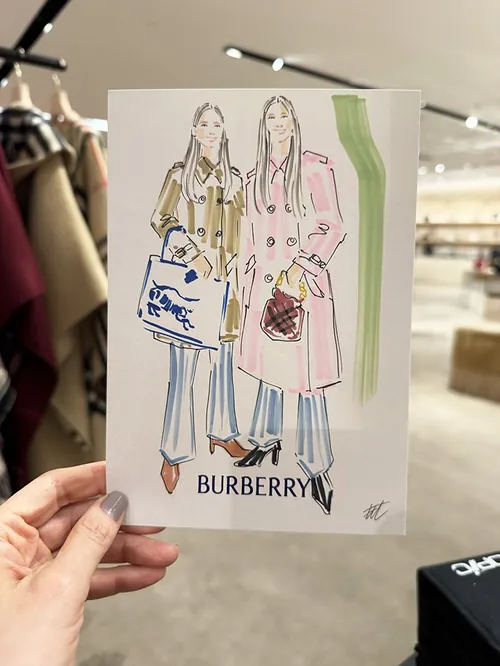Burberry fashion illustration of two women in coats by Elise Lee