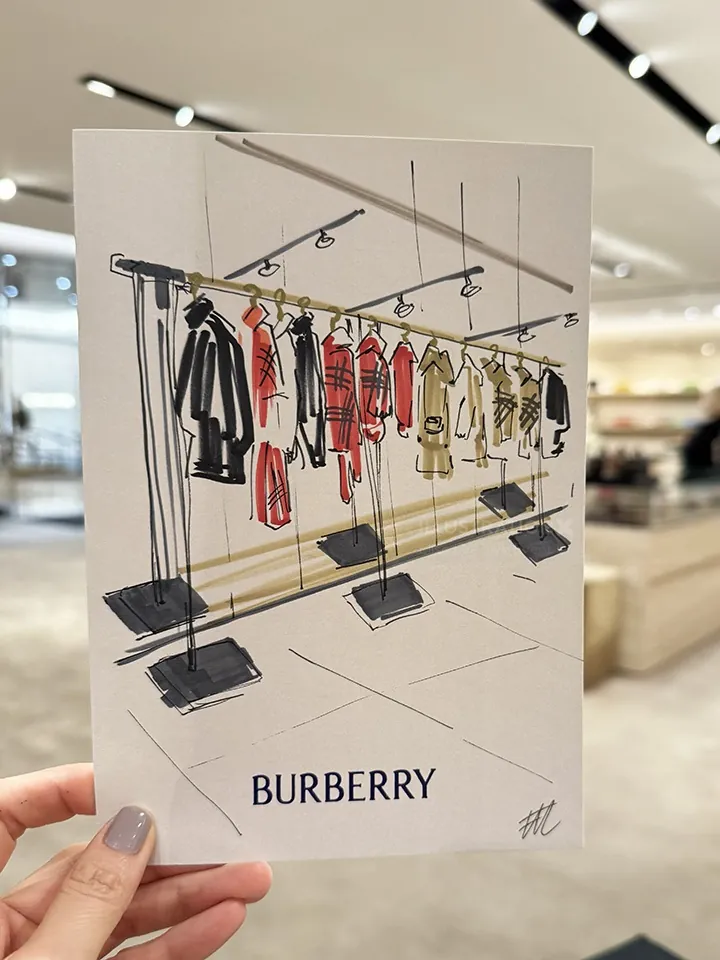 Live Burberry clothing rack illustration by Elise Lee