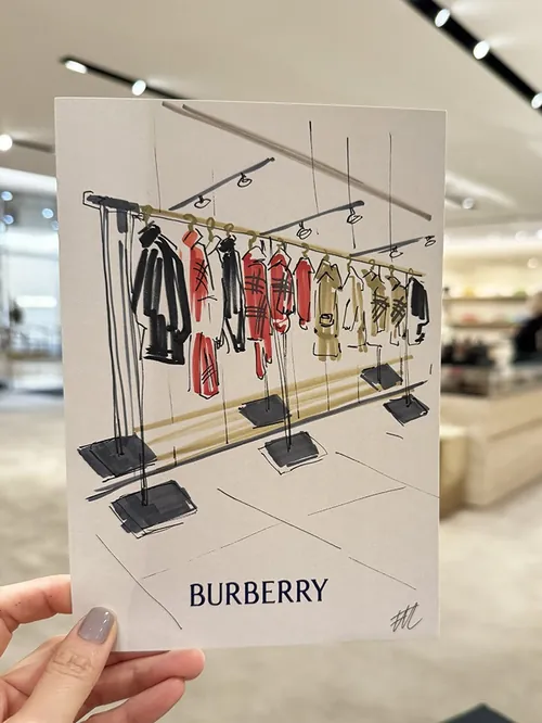 Live Burberry clothing rack illustration by Elise Lee
