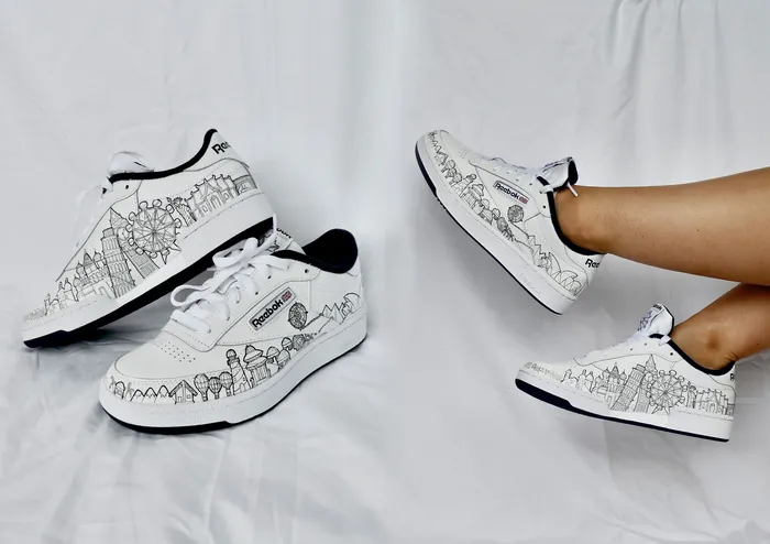 White sneakers with black skyline design by Ellie Compton