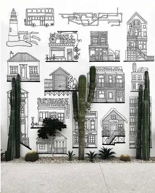 Wall mural with various architectural sketches and cacti by Ellie Compton