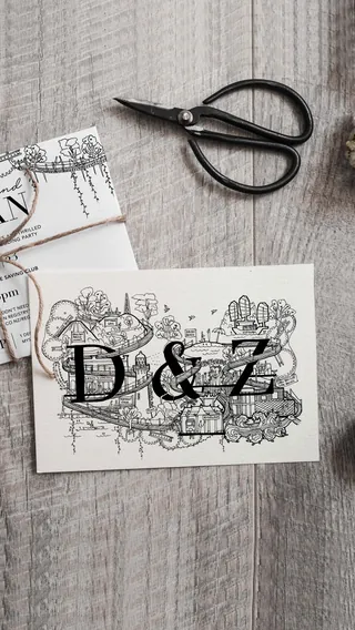 Wedding invitation card with D and Z initials and floral decorations