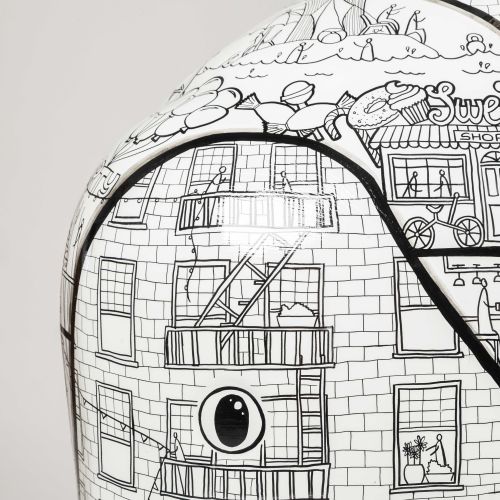 Detailed black and white cityscape drawing on curved object