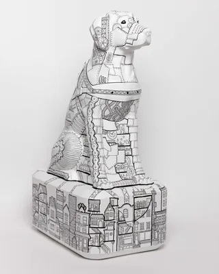 Detailed black and white geometric dog sculpture on pedestal