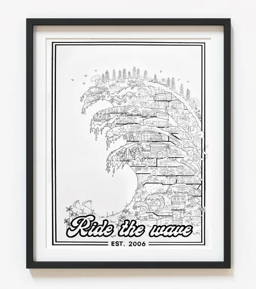 Framed black and white art showing a detailed wave with city elements