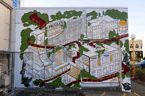 Fresque d'histoire architecturale réalisée par Ellie Compton représentant des bâtiments de Christchurch et un tapis rouge
