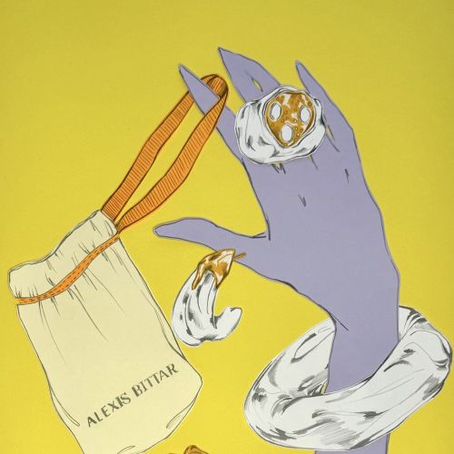 Purple hand with white accessories holding crystals and pouch