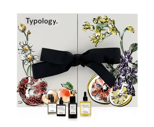 Typology fragrance set with floral artwork and tied with a black bow by Elly Azizian
