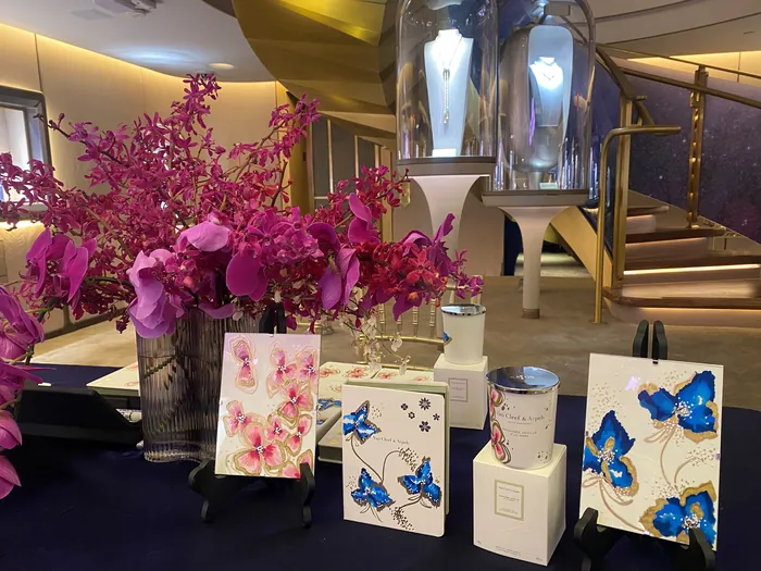 Floral arrangements and blue butterfly art cards by Elly Azizian