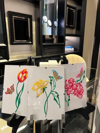 Colorful floral sketches with butterfly on paper by Elly Azizian