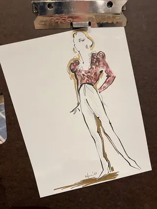 Fashion sketch of woman wearing high-waisted pants and puffed sleeve top