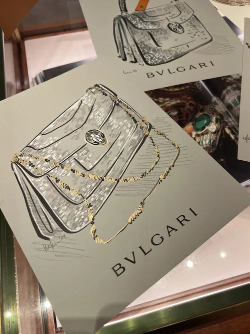 Illustration of Bvlgari handbag with chain and jewelry