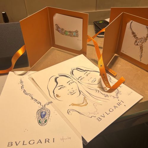 BVLGARI jewelry sketches and portraits on paper with orange folders