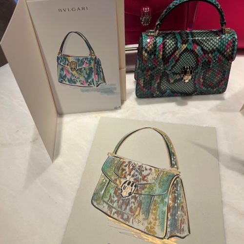Bvlgari handbags with colorful designs and promotional cards
