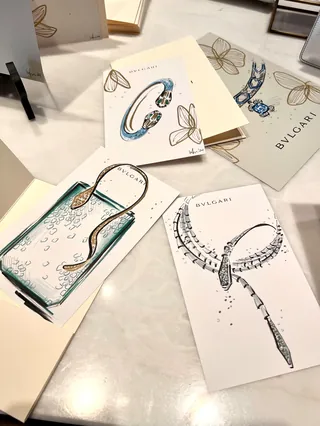 BVLGARI jewelry design sketches on display cards on a table