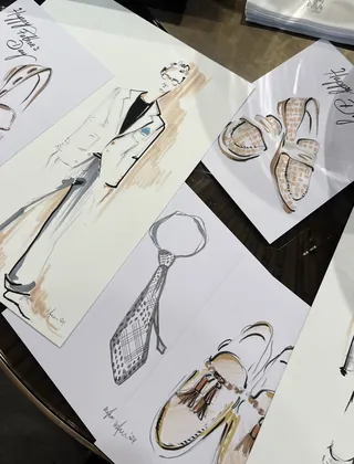 Fashion illustrations of a men's suit, tie, and footwear designs