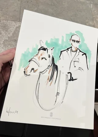 Sketch of a man wearing sunglasses standing beside a horse
