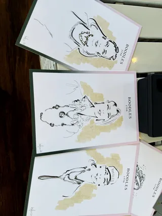 Three abstract portraits with gold highlights on white paper