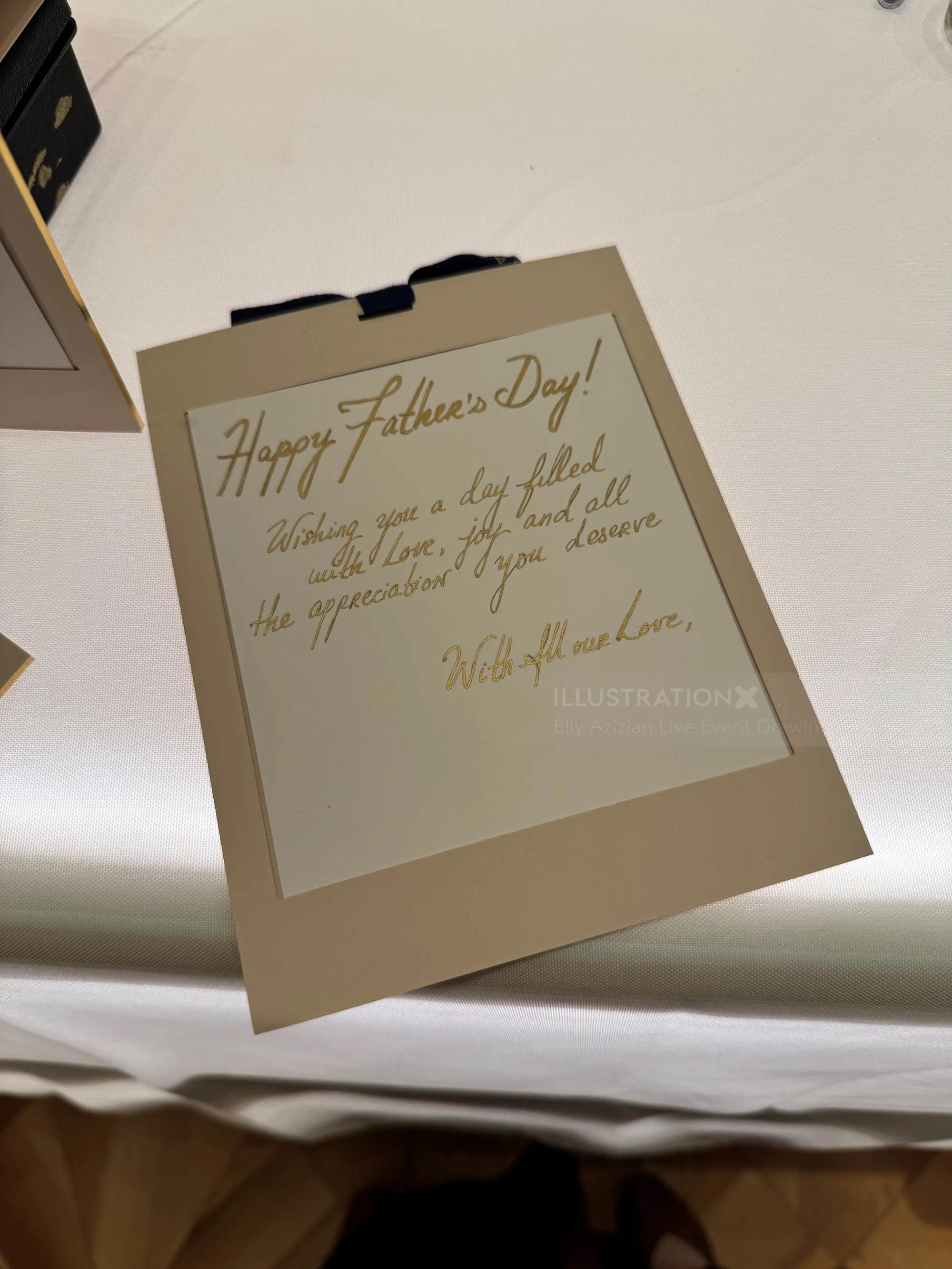 Father's Day card with handwritten message on clipboard