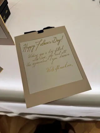 Father's Day card with handwritten message on clipboard
