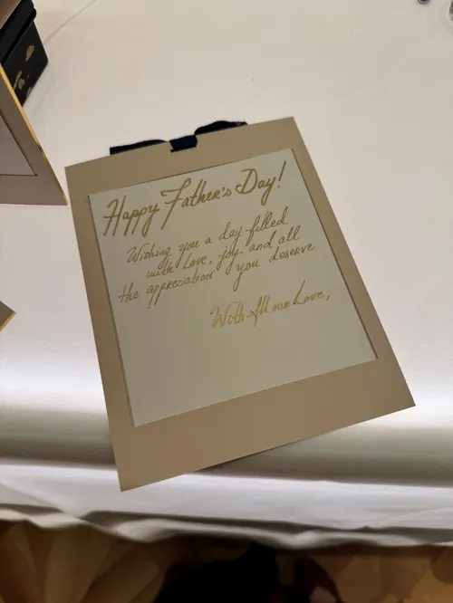 Father's Day card with handwritten message on clipboard