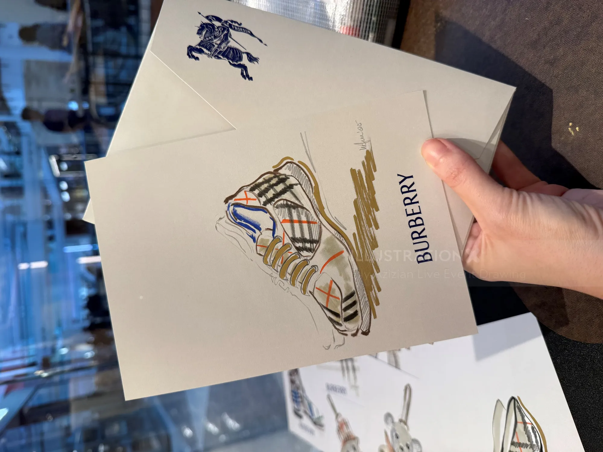 Burberry sneaker drawing on card held by hand by Elly Azizian