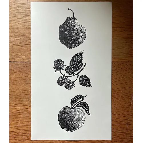 Lino print of a pear, blackberries, and an apple by Emily Robertson