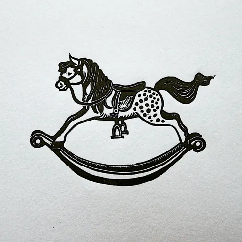 Lino cut print of a rocking horse by Emily Robertson