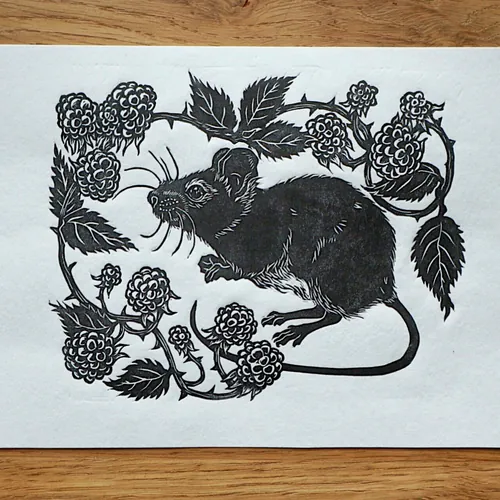 Black and white lino cut of a mouse with blackberries by Emily Robertson