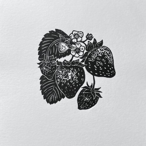 Black and white lino cut print of strawberries and flowers by Emily Robertson