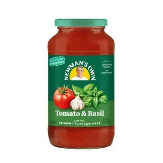 Jar of Newman's Own Tomato & Basil pasta sauce with label showing tomato, garlic, basil