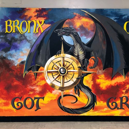 Dragon holding compass with fiery sky background by Esther Stimphat