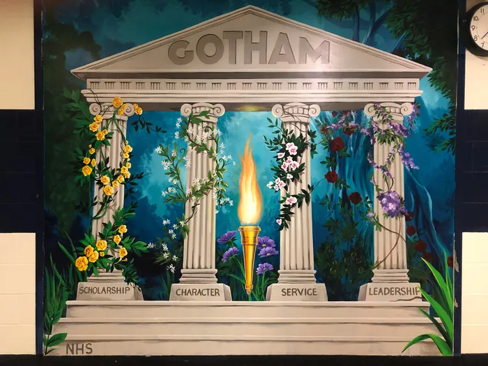 Mural of Gotham pillars symbolizing scholarship, character, service, and leadership by Esther Stimph