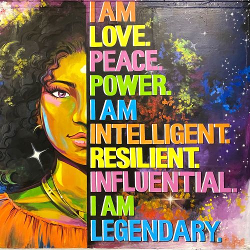 Portrait of a woman with affirmations about love, peace, power, intelligent by Esther Stimphat