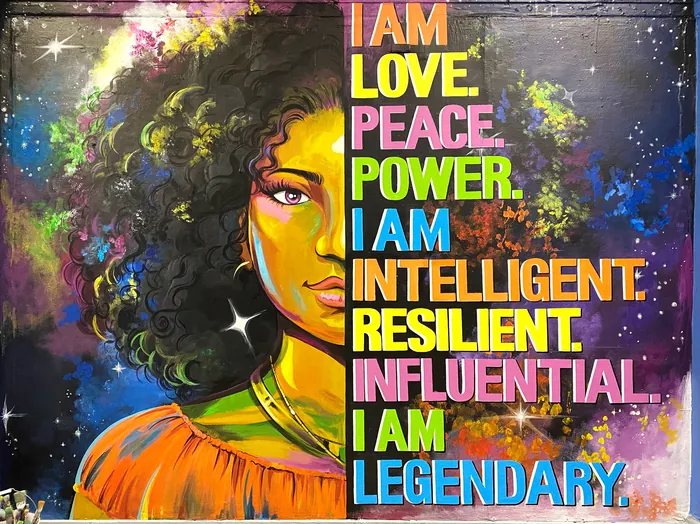 Portrait of a woman with affirmations about love, peace, power, intelligent by Esther Stimphat