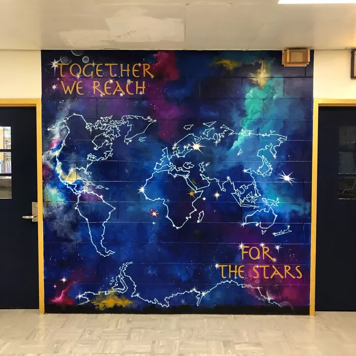 World map mural with stars and Motivational quote by Esther Stimphat