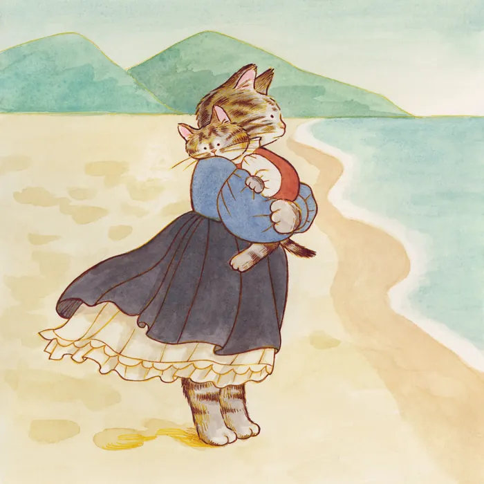 Cat wearing dress hugging kitten on beach with mountains in background
