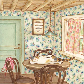 Cat sleeping on wooden table in a floral wallpapered cozy room