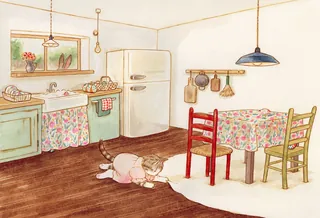 Child playing on wooden floor in cozy vintage kitchen