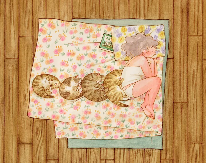 Person and tabby cat sleeping on floral bed sheets