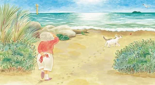 Child looking at dog on sandy beach with ocean and plants
