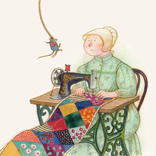Woman sewing a colorful patchwork quilt with vintage sewing machine