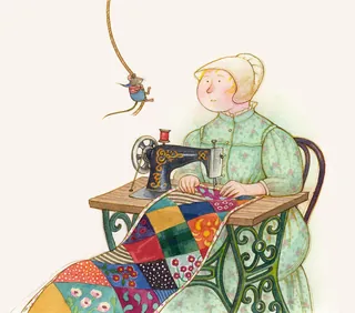 Woman sewing a colorful patchwork quilt with vintage sewing machine