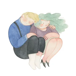 Two people sitting closely with one comforting the other