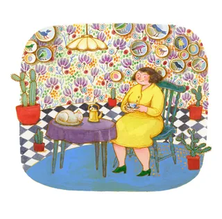 Woman in yellow dress drinking tea at table with cat sleeping nearby