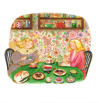 Two women drinking tea with desserts and a cat on table