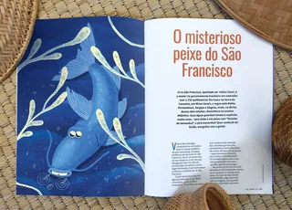 Open book showing a blue fish illustration and text in Portuguese about peixe do São Francisco