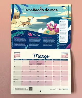 Calendar open to March with seaside dog illustration and marine text